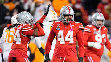 Ohio State Buckeyes defensive end JT Tuimoloau (44) celebrates a sack and forced fumble during the second half of the College Football Playoff first round game against the Tennessee Volunteers at Ohio Stadium in Columbus on Dec. 22, 2024. Ohio State won 42-17.