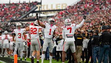 Ohio State Buckeyes cornerback Jermaine Mathews Jr. (7) celebrates an interception with Ohio State Buckeyes cornerback Davison Igbinosun (1) during the NCAA football game against the Purdue Boilermakers at Ross-Ade Stadium in West Lafayette, Ind. on Nov. 8, 2025.