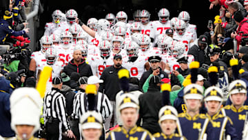Ohio State Buckeyes head coach Ryan Day leads his team onto the field prior to the NCAA football game against the Michigan Wolverines at Michigan Stadium in Ann Arbor, Mich. on Nov. 29, 2025.