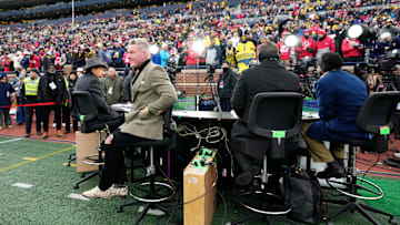 The ESPN College GameDay crew broadcast from the field at Michigan Stadium during the NCAA football game between the Michigan Wolverines and the Ohio State Buckeyes in Ann Arbor, Mich. on Nov. 29, 2025. Ohio State won 27-9.