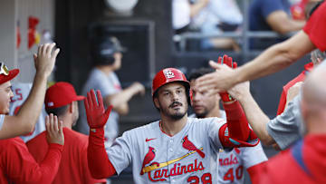 Jun 19, 2025; Chicago, Illinois, USA; St. Louis Cardinals third baseman Nolan Arenado (28) celebrates with teammates in the dugout after hitting a solo home run against the Chicago White Sox during the third inning of game two of a doubleheader at Rate Field. Mandatory Credit: Kamil Krzaczynski-Imagn Images