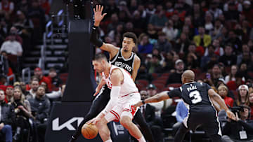 Jan 6, 2025; Chicago, Illinois, USA; San Antonio Spurs center Victor Wembanyama (1) defends against Chicago Bulls center Nikola Vucevic (9) during the first half at United Center. Mandatory Credit: Kamil Krzaczynski-Imagn Images