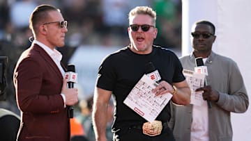 ESPN's AJ Hawk, left, and Pat McAfee broadcast from the sideline during the College Football Playoff quarterfinal between the Ohio State Buckeyes and the Oregon Ducks at the Rose Bowl in Pasadena, Calif. on Jan. 1, 2025. Ohio State won 41-21.