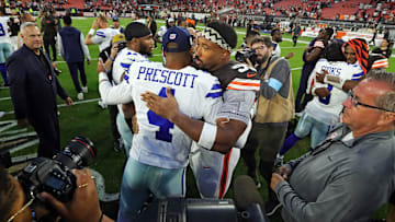 Cleveland Browns star Myles Garrett hugs Dallas Cowboys quarterback Dak Prescott after losing in an NFL football game
