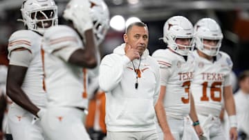 Texas Longhorns head coach Steve Sarkisian leads warm ups prior to the Cotton Bowl Classic College Football Playoff.