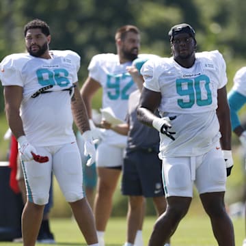 Miami Dolphins defensive tackle Kenneth Grant (90) warms up during joint training camp practice with the Chicago Bears ahead of Sunday's preseason opener.