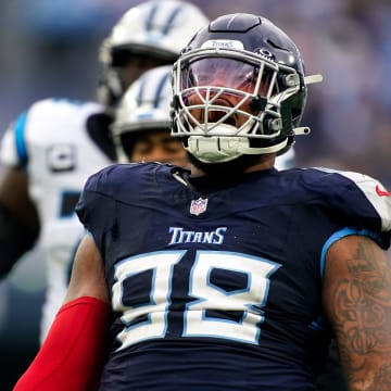 Tennessee Titans defensive tackle Jeffery Simmons (98) celebrates sacking Carolina Panthers quarterback Bryce Young during the third quarter at Nissan Stadium in Nashville, Tenn., Sunday, Nov. 26, 2023.