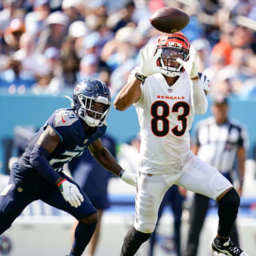 Cincinnati Bengals wide receiver Tyler Boyd (83) brings in a pass for a first down past Tennessee Titans cornerback Roger McCreary (21) during the third quarter at Nissan Stadium in Nashville, Tenn., Sunday, Oct. 1, 2023.