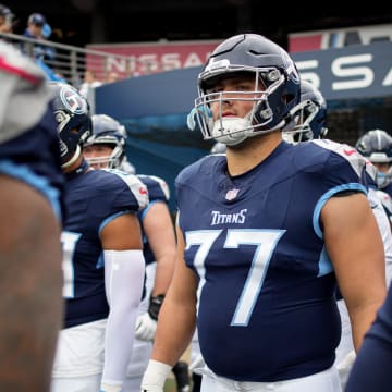 Tennessee Titans offensive tackle Peter Skoronski (77) heads out for warm ups before a game against the Carolina Panthers at Nissan Stadium in Nashville, Tenn., Sunday, Nov. 26, 2023.