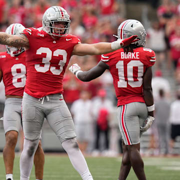 Aug 31, 2024; Columbus, OH, USA; Ohio State Buckeyes defensive end Jack Sawyer (33) reacts to a hit during the second half of the NCAA football game against the Akron Zips at Ohio Stadium. Ohio State won 52-6.