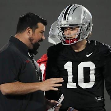 Mar 7, 2024; Columbus, OH, USA; Ohio State Buckeyes head coach Ryan Day talks to quarterback Julian Sayin (10) during spring football practice at the Woody Hayes Athletic Center.