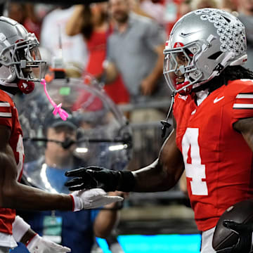 Ohio State Buckeyes wide receiver Carnell Tate (17) celebrates a touchdown by wide receiver Jeremiah Smith (4) during the first half of the NCAA football game against the Minnesota Golden Gophers at Ohio Stadium in Columbus on Oct. 4, 2025.