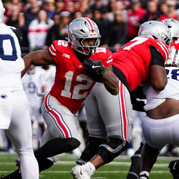 Ohio State Buckeyes running back CJ Donaldson Jr. (12) runs during the NCAA football game against the Penn State Nittany Lions at Ohio Stadium in Columbus on Nov. 1, 2025.