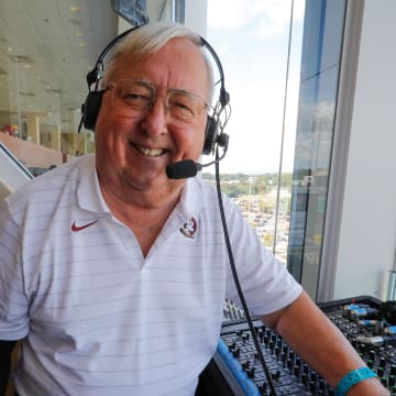 Sep 18, 2021; Winston-Salem, North Carolina, USA;  Gene Deckerhoff has been calling the Florida State Seminoles football games since 1979 along with FSU basketball since 1974 and the NFL   s Tampa Bay Buccaneers since 1989. Here he prepares to call the game between the Wake Forest Demon Deacons and the Florida State Seminoles at Truist Field. Mandatory Credit: Reinhold Matay-USA TODAY Sports
