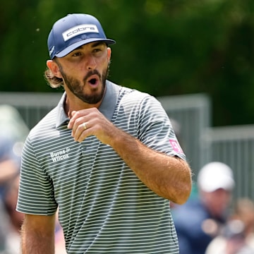 Max Homa reacts to a missed birdie putt on the eighth green.