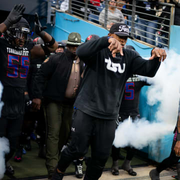 Tennessee State head coach Eddie George leads his team to the field to face Norfolk State in the TSU homecoming game at Nissan Stadium in Nashville, Tenn., Saturday, Oct. 14, 2023.