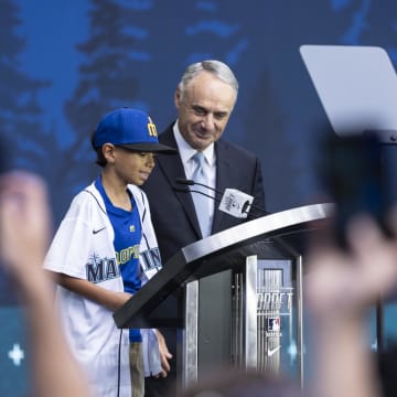MLB commissioner Rob Manfred, right, and Tiago Viernes announce the Seattle Mariners pick during the first round of the MLB Draft at Lumen Field in 2023.
