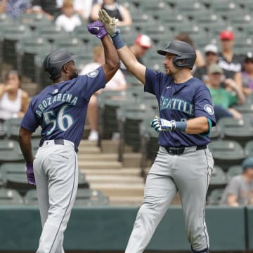 Seattle Mariners catcher Cal Raleigh (right) celebrates with outfielder Randy Arozarena (left) after hitting a two-run home run against the Chicago White Sox.