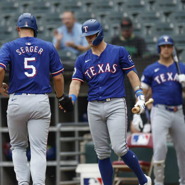 Aug 28, 2024; Chicago, IL, USA; Texas Rangers shortstop Corey Seager (5) celebrates with third baseman Josh Jung (6) after scoring against the Chicago White Sox during the first inning of game one of the doubleheader at Guaranteed Rate Field. Mandatory Credit: Kamil Krzaczynski-USA TODAY Sports