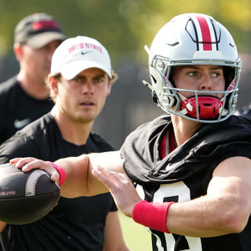 Aug 1, 2024; Columbus, OH, USA; Ohio State Buckeyes quarterback Will Howard (18) throws during football camp at the Woody Hayes Athletic Complex.