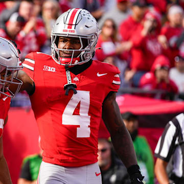 Ohio State Buckeyes running back TreVeyon Henderson (32) celebrates with wide receiver Jeremiah Smith (4) after Henderson scored a touchdown in the second half at Ohio Stadium on Saturday, Nov. 9, 2024 in Columbus, Ohio.
