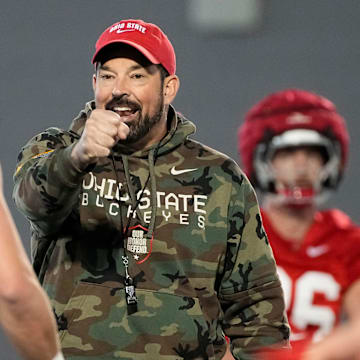 Ohio State Buckeyes coach Ryan Day motions to quarterback Lincoln Kienholz during spring football practice.