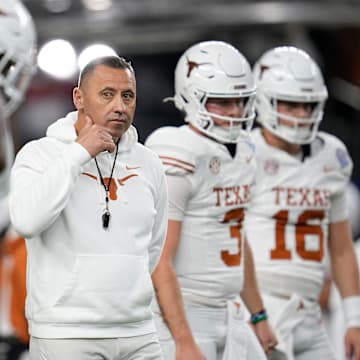 Texas Longhorns head coach Steve Sarkisian leads warm ups prior to the Cotton Bowl Classic College Football Playoff semifinal game between the Ohio State Buckeyes and the Texas Longhorns at AT&T Stadium in Arlington, Texas on Jan. 10, 2025.