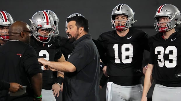 Mar 7, 2024; Columbus, OH, USA; Ohio State Buckeyes head coach Ryan Day talks to quarterbacks during spring football practice at the Woody Hayes Athletic Center.