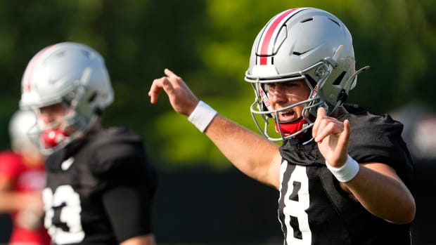 Aug 8, 2024; Columbus, Ohio, USA; Ohio State Buckeyes quarterback Will Howard (18) calls out a play during football practice 