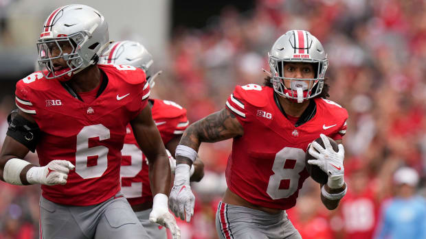 Ohio State Buckeyes safety Lathan Ransom (8) scoops up a fumble and returns it for a touchdown 