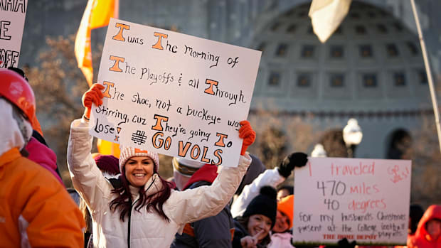 Fans hold up signs on the set of ESPN College GameDay prior to the College Football Playoff first round game between the Ohio