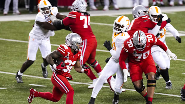 Dec 21, 2024; Columbus, Ohio, USA; Ohio State Buckeyes running back TreVeyon Henderson (32) runs the ball against the Tenness