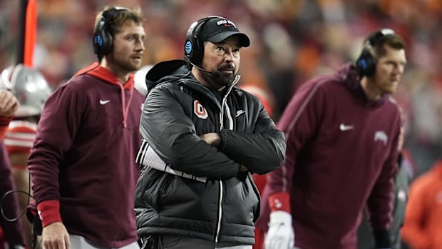 Dec 21, 2024; Columbus, Ohio, USA; Ohio State Buckeyes head coach Ryan Day watches from the sideline during the first half of