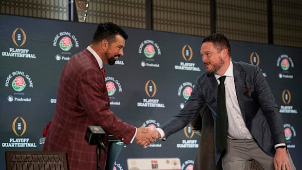 Ohio State Buckeyes head coach Ryan Day shakes hands with Oregon Ducks head coach Dan Lanning during a Rose Bowl press confer