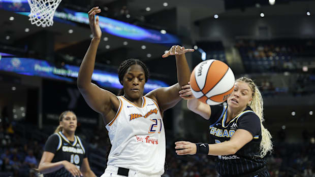 A photo of Kalani Brown going for the ball