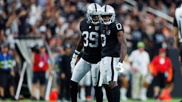 Jakorian Bennett with Nate Hobbs.