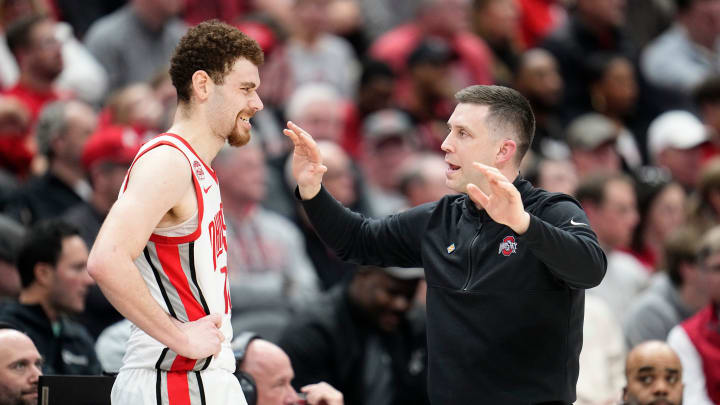 Mar 26, 2024; Columbus, OH, USA; Ohio State Buckeyes head coach Jake Diebler talks to forward Jamison Battle (10) during the second half of the NIT quarterfinals against the Georgia Bulldogs at Value City Arena. Ohio State lost 79-77.