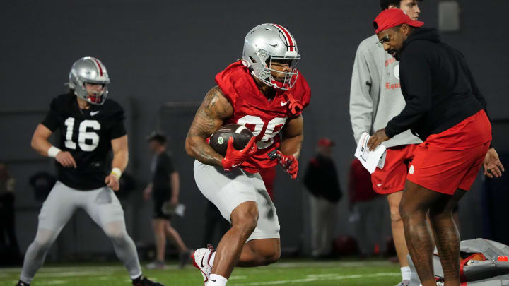 Mar 7, 2024; Columbus, OH, USA; Ohio State Buckeyes running back TC Caffey (28) runs during spring football practice at the Woody Hayes Athletic Center.