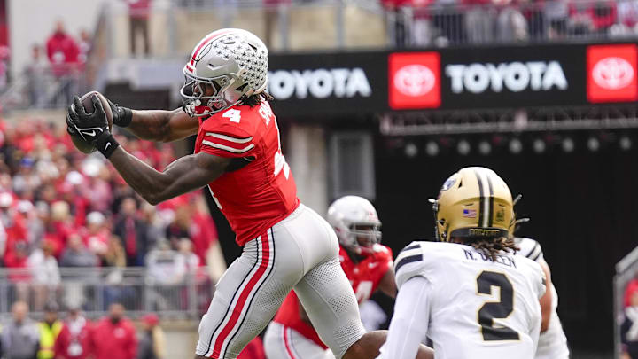 Nov 9, 2024; Columbus, Ohio, USA; Ohio State Buckeyes wide receiver Jeremiah Smith (4) catches a pass in the first half against the Purdue Boilermakers at Ohio Stadium. Mandatory Credit: Samantha Madar-Imagn Images