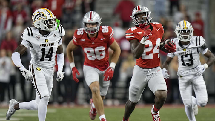 Sep 7, 2024; Columbus, Ohio, USA;  Ohio State Buckeyes running back Sam Williams-Dixon (24) runs upfield past Western Michigan Broncos cornerback Lorenzo Williams Jr. (14) during the second half at Ohio Stadium.  Mandatory Credit: Adam Cairns-Imagn Images