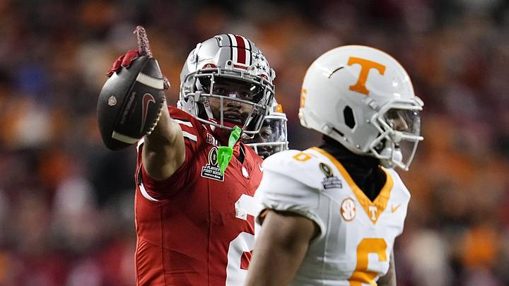 Ohio State Buckeyes wide receiver Emeka Egbuka (2) celebrates a first down catch behind Tennessee Volunteers defensive back Jalen McMurray (6) during the first half of the College Football Playoff first round game at Ohio Stadium in Columbus on Dec. 21, 2024.