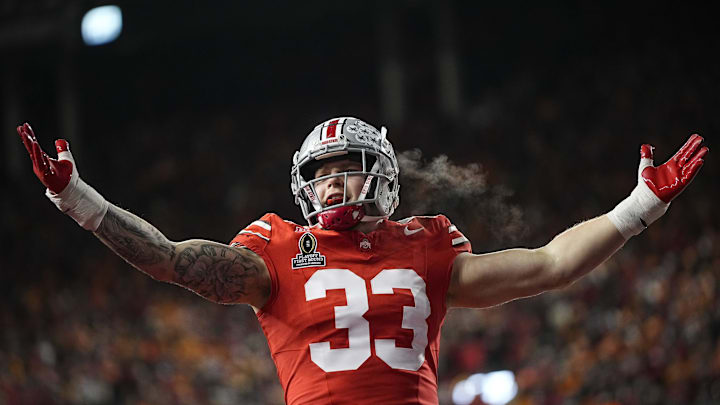Ohio State Buckeyes defensive end Jack Sawyer (33) celebrates a sack of Tennessee Volunteers quarterback Nico Iamaleava (8) during the first half of the College Football Playoff first round game at Ohio Stadium in Columbus on Dec. 21, 2024.