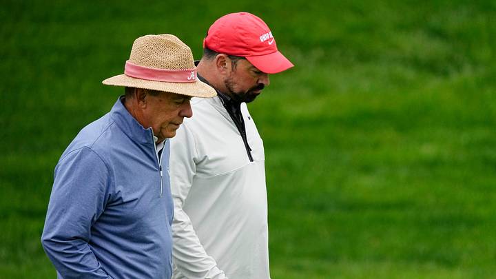 Nick Saban and Ryan Day walk the 14th fairway during the Workday Golden Bear Pro-Am at Muirfield Village Golf Club in Dublin, Ohio on May 28, 2025.