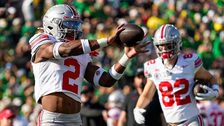 Ohio State Buckeyes safety Caleb Downs (2) catches a ball during warm ups prior to the College Football Playoff quarterfinal against the Oregon Ducks at the Rose Bowl in Pasadena, Calif. on Jan. 1, 2025.
