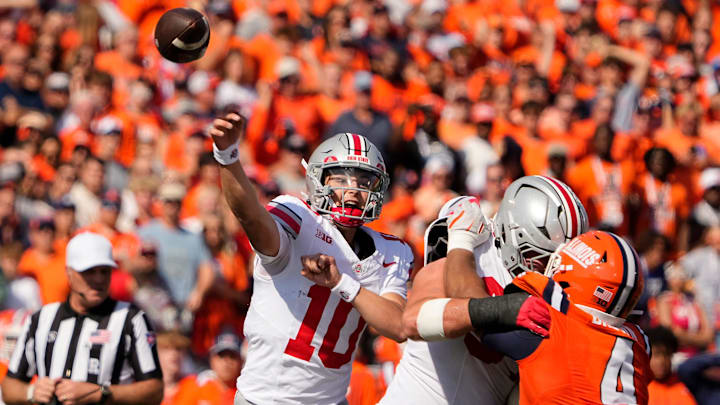 Ohio State Buckeyes quarterback Julian Sayin (10) throws during the first half of the NCAA football game against the Illinois Fighting Illini at Gies Memorial Stadium in Champaign on Oct. 11, 2025.