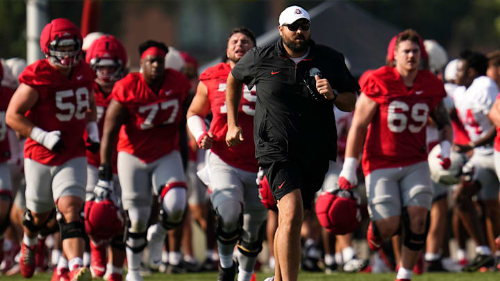 Ohio State Buckeyes offensive line coach Tyler Bowen runs during football training camp at the Woody Hayes Athletic Center on Aug. 1, 2025.