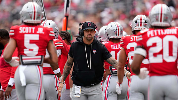 Ohio State Buckeyes linebackers coach James Laurinaitis high fives players during the NCAA football game against the Grambling State Tigers at Ohio Stadium on Sept. 6, 2025.