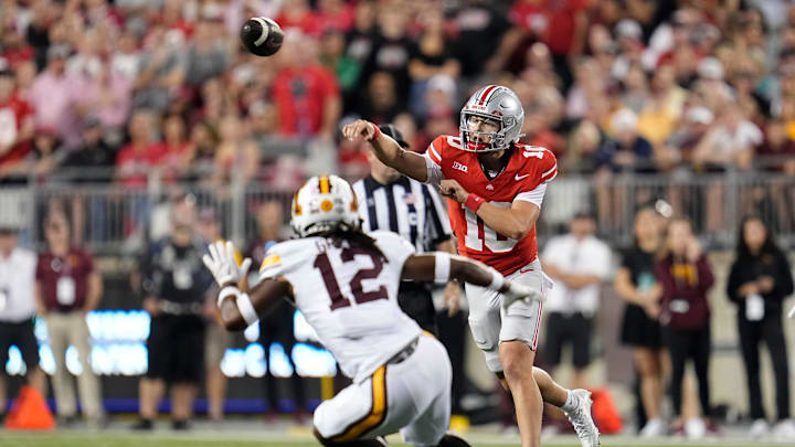 Ohio State Buckeyes quarterback Julian Sayin (10) throws over Minnesota Golden Gophers defensive back Darius Green (12) during the first half of the NCAA football game at Ohio Stadium in Columbus on Oct. 4, 2025.