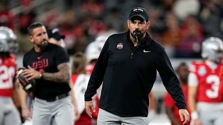 Ohio State Buckeyes head coach Ryan Day leads warm-ups prior to the Cotton Bowl at AT&T Stadium in Arlington, Texas for the College Football Playoff quarterfinal game against the Miami Hurricanes on Dec. 31, 2025.