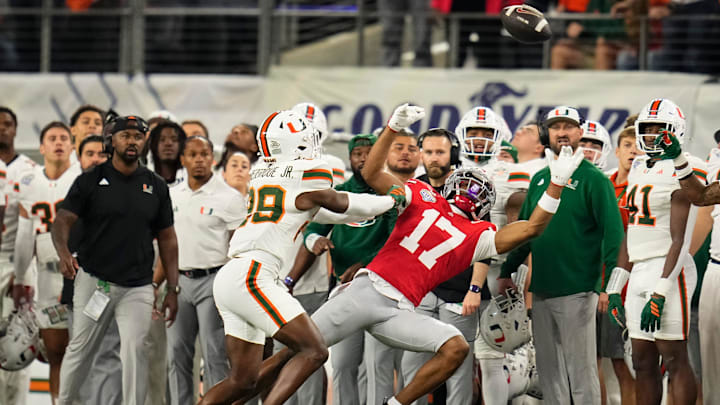 Miami Hurricanes defensive back Jr. Romanas Frederique (29) defends Ohio State Buckeyes wide receiver Carnell Tate (17) during the Cotton Bowl at AT&T Stadium in Arlington, Texas for the College Football Playoff quarterfinal game on Dec. 31, 2025.